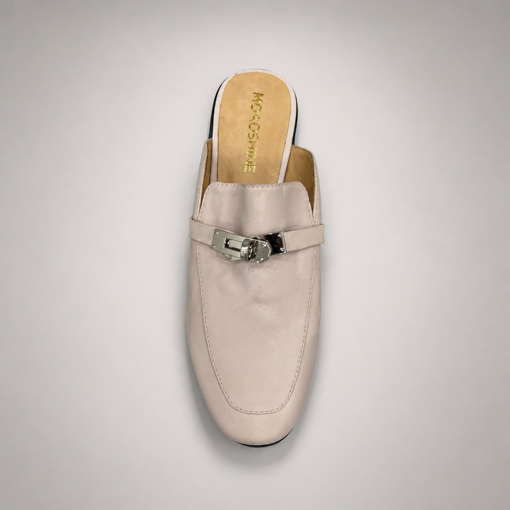 Ivory mule loafer rear view showing an open-back mule construction and metal vamp accent