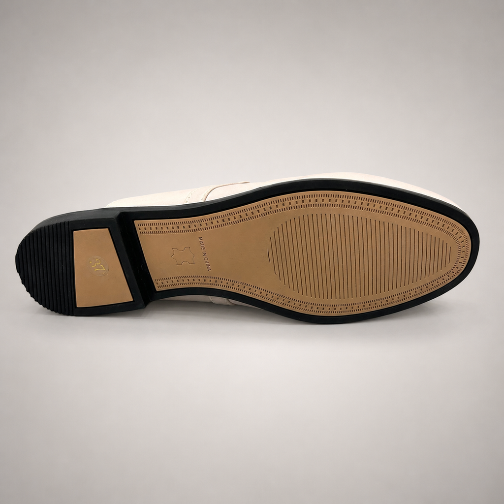 Ivory mule loafer outsole view showing the cow leather outsole