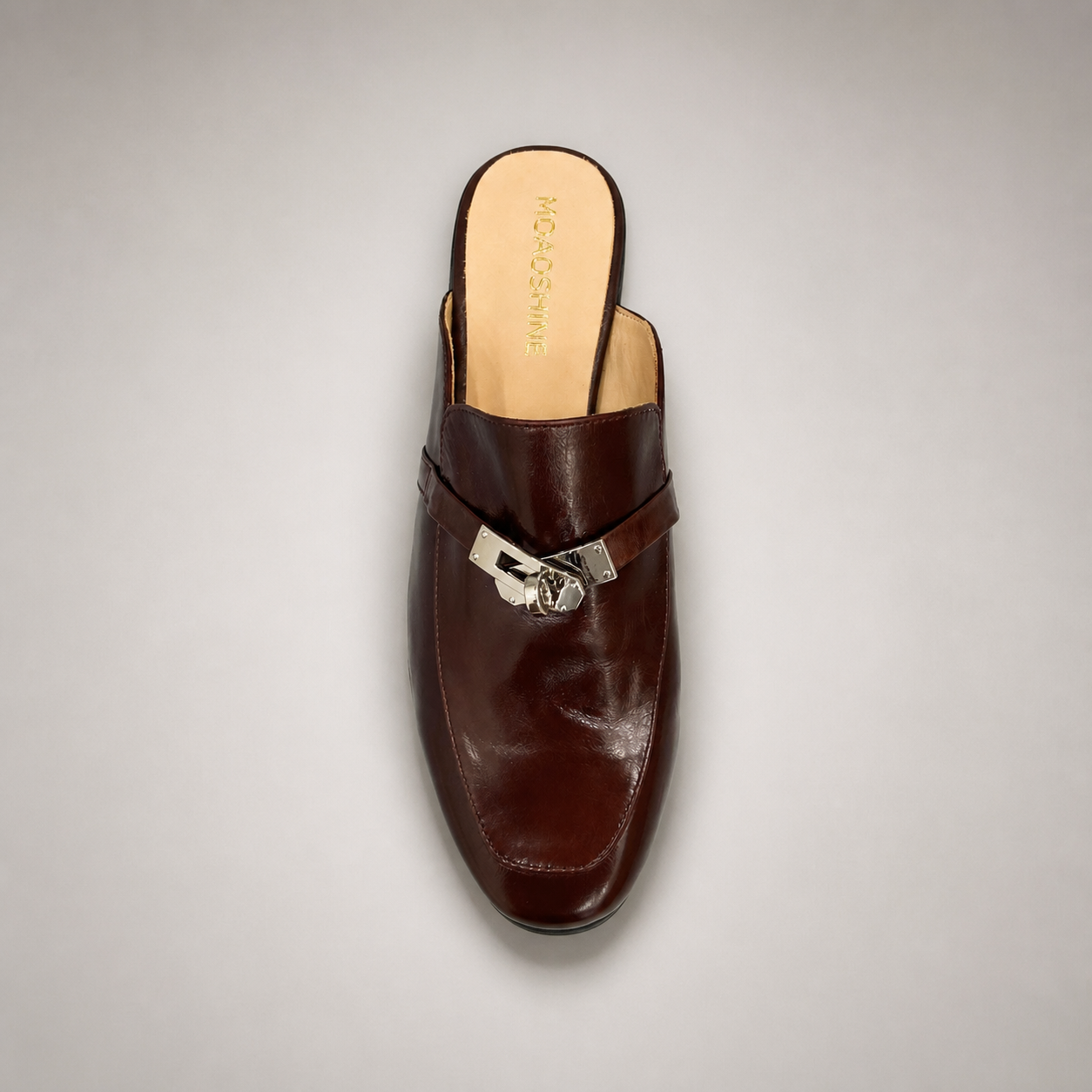 Brown mule loafer outsole view showing the cow leather outsole