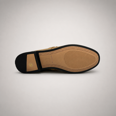 Tan mule loafer rear view showing an open-back mule construction and metal vamp accent