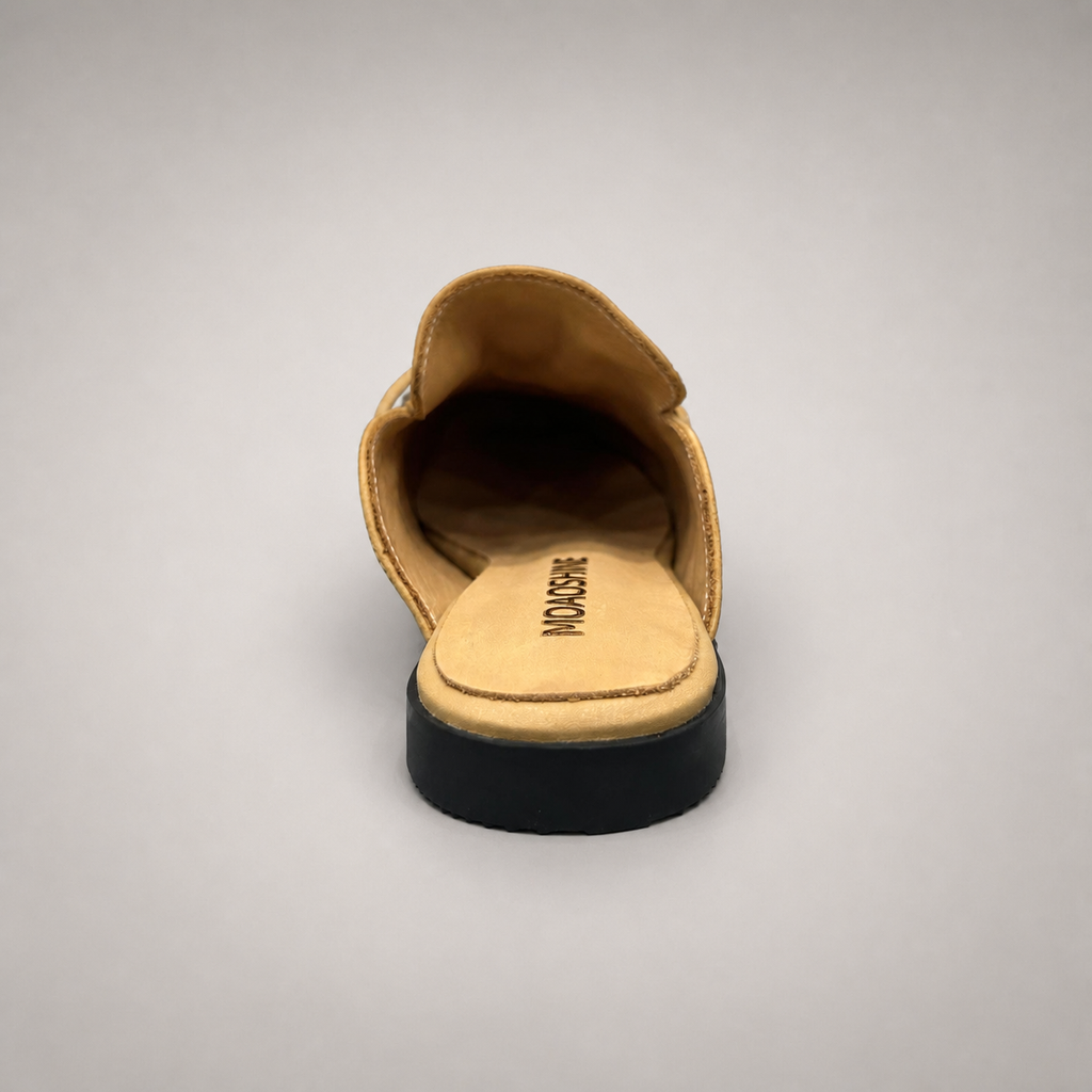 Tan mule loafer top view showing an open-back mule construction and metal vamp accent