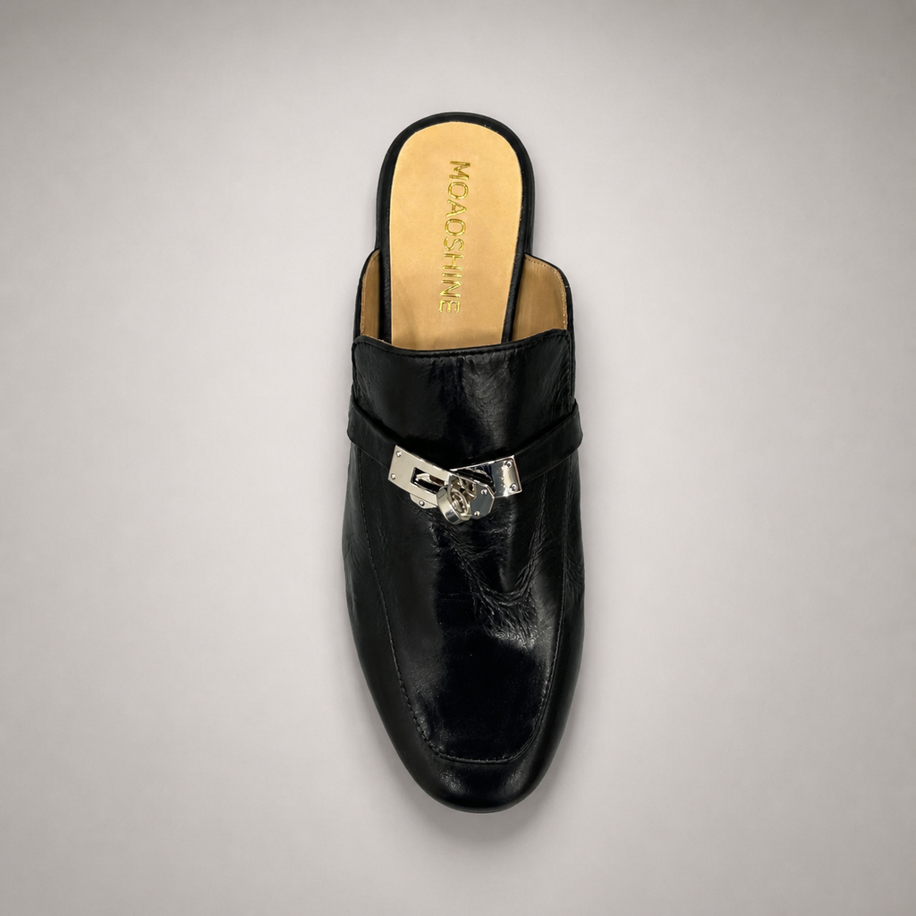 Black mule loafer outsole view showing the cow leather outsole
