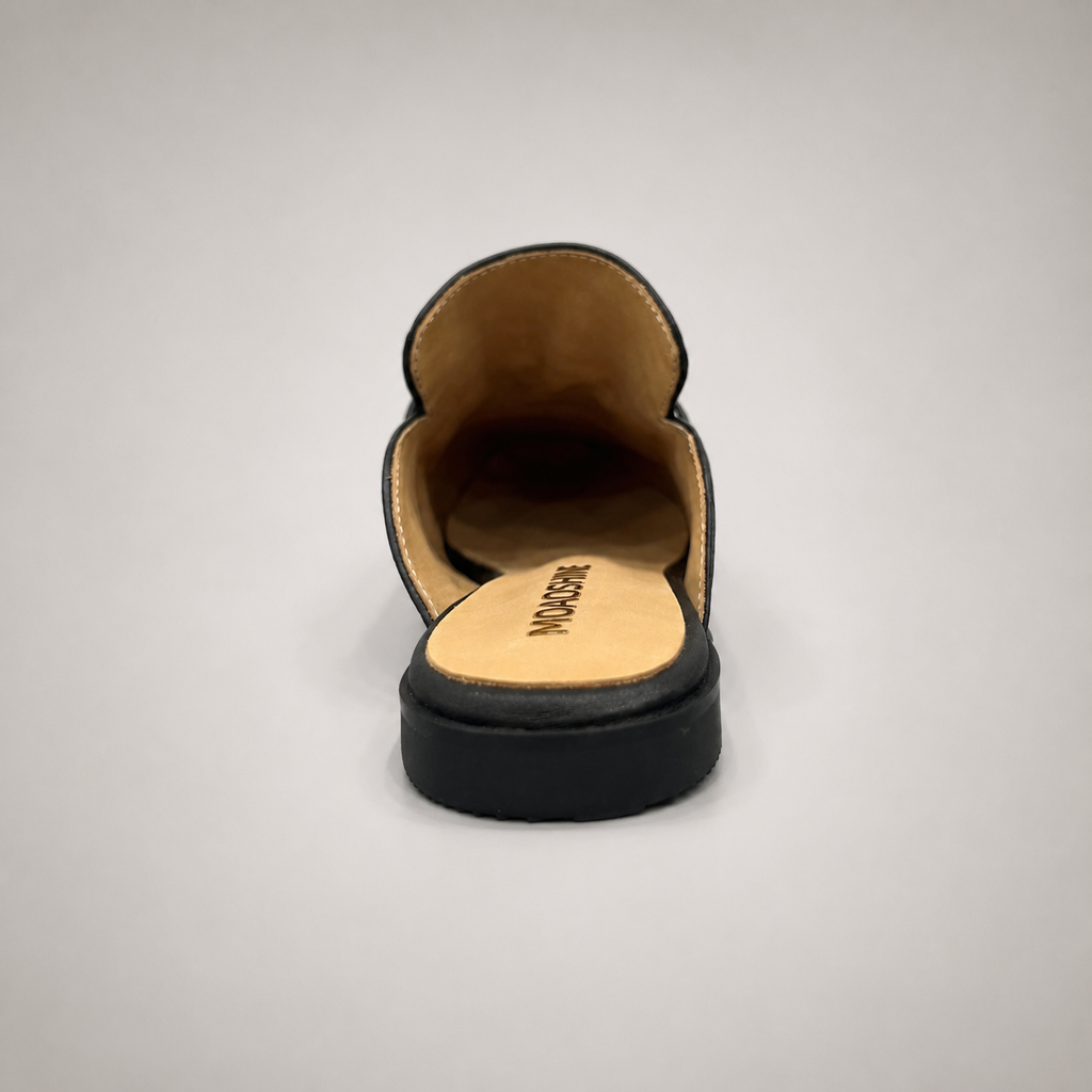 Black mule loafer top view showing an open-back mule construction and metal vamp accent