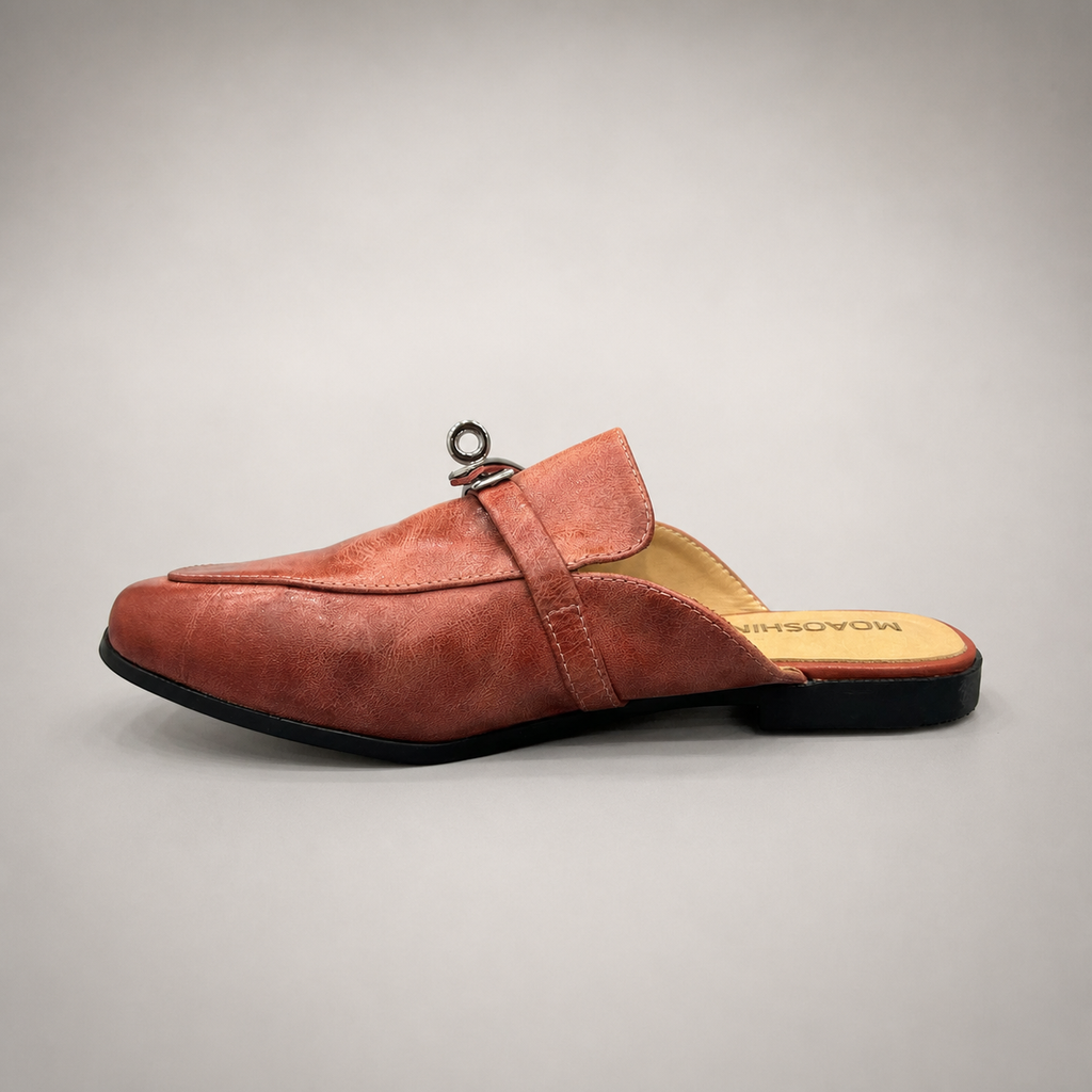 Rust mule loafer opposite side profile showing an open-back mule construction and metal vamp accent
