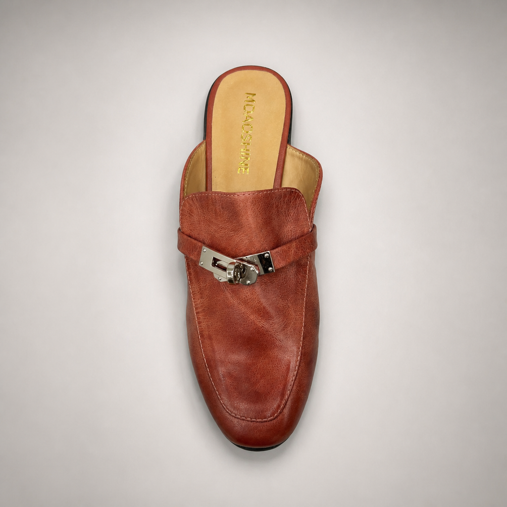 Rust mule loafer rear view showing an open-back mule construction and metal vamp accent