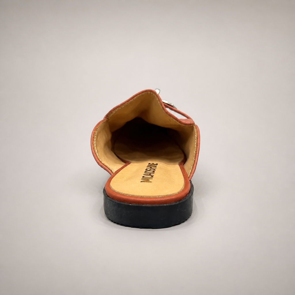 Rust mule loafer top view showing an open-back mule construction and metal vamp accent