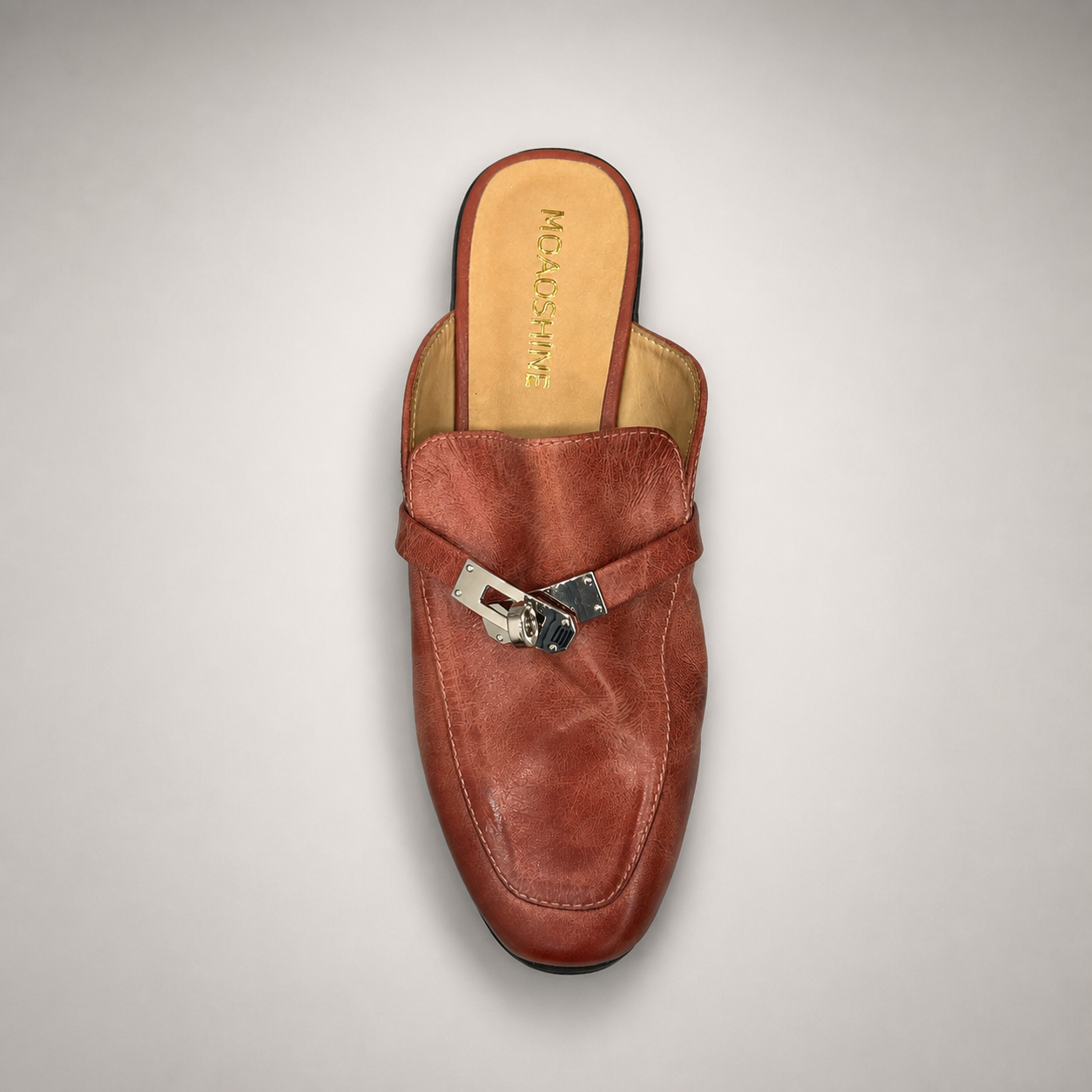 Rust mule loafer outsole view showing the cow leather outsole