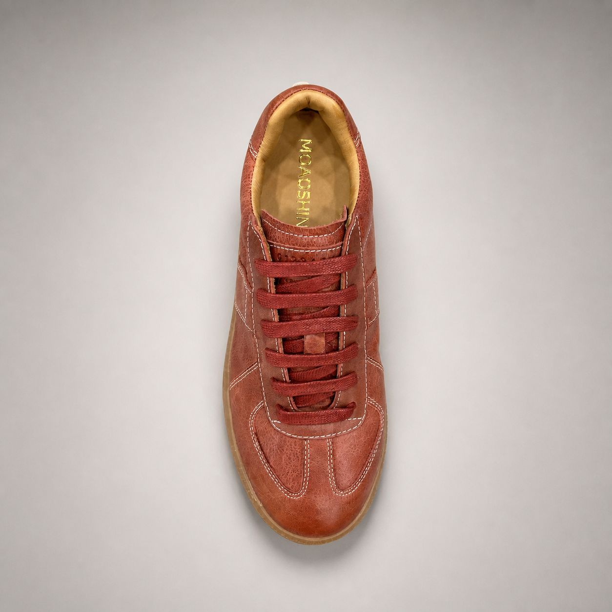 Rust platform sneaker top view showing a lace-up upper and raised platform sole