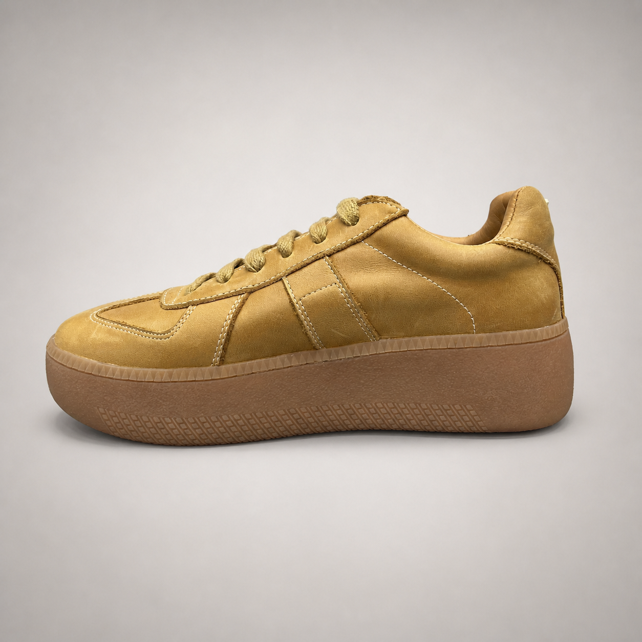 Tan platform sneaker opposite side profile showing a lace-up upper and raised platform sole