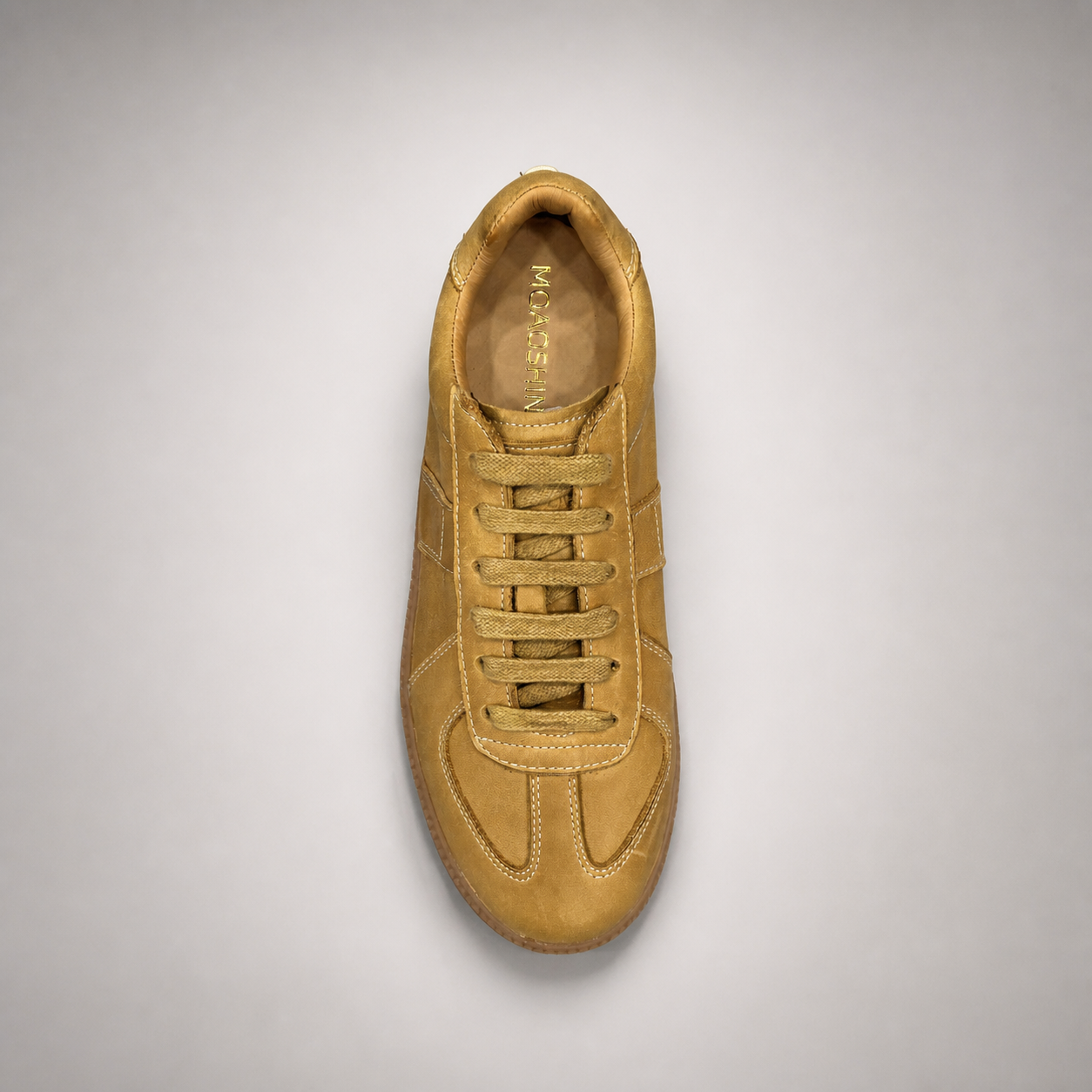 Tan platform sneaker outsole view showing the rubber outsole