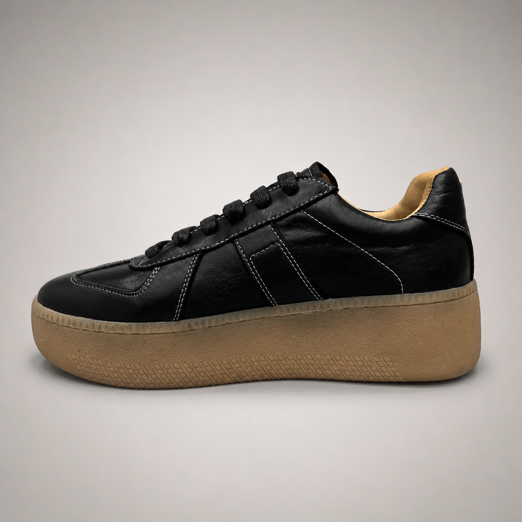 Black platform sneaker opposite side profile showing a lace-up upper and raised platform sole