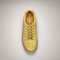 Yellow platform sneaker outsole view showing the rubber outsole