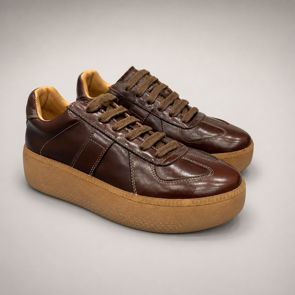 Brown platform sneaker pair three-quarter view showing a lace-up upper and raised platform sole