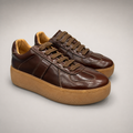 Brown platform sneaker pair three-quarter view showing a lace-up upper and raised platform sole
