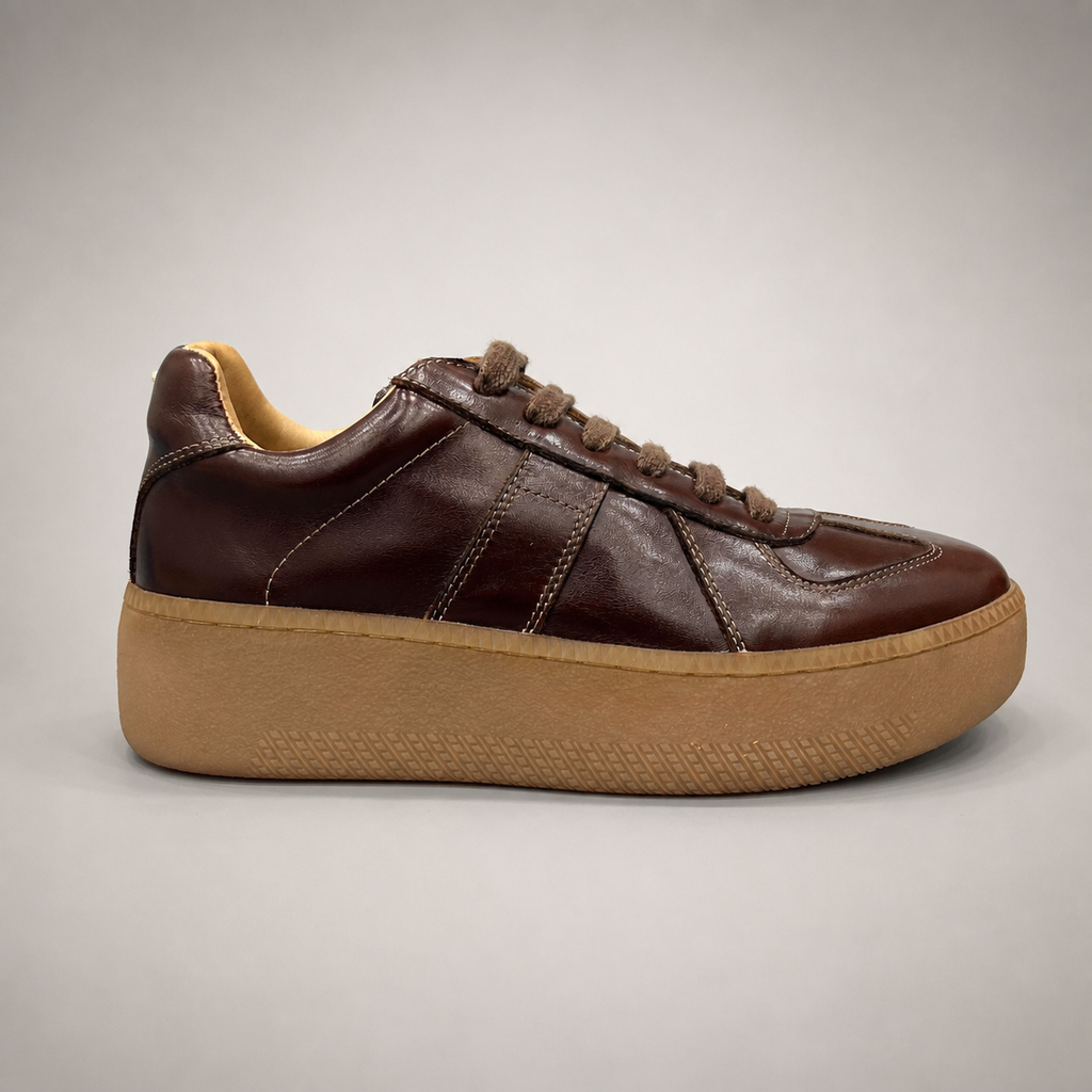 Brown platform sneaker side profile showing a lace-up upper and raised platform sole
