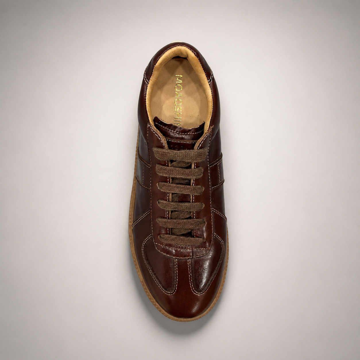 Brown platform sneaker top view showing a lace-up upper and raised platform sole