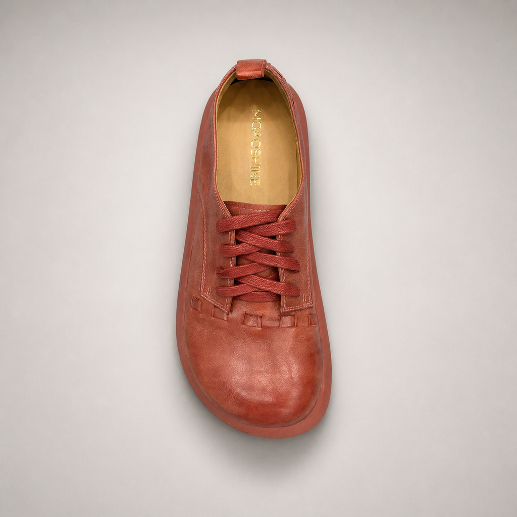 Rust low-top sneaker top view showing a lace-up low-top construction