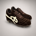 Dark Brown soccer shoe pair three-quarter view showing a lace-up upper and molded outsole studs