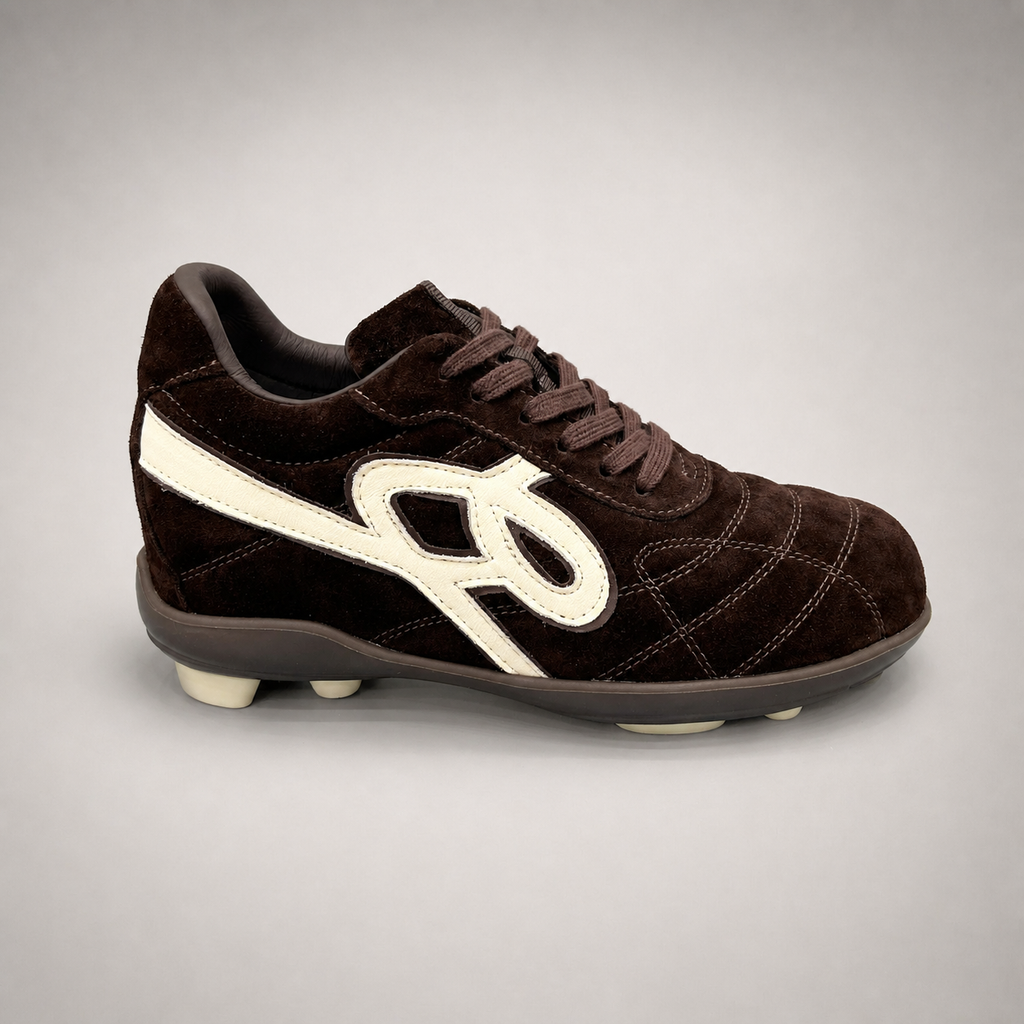 Dark Brown soccer shoe second pair angle showing a lace-up upper and molded outsole studs