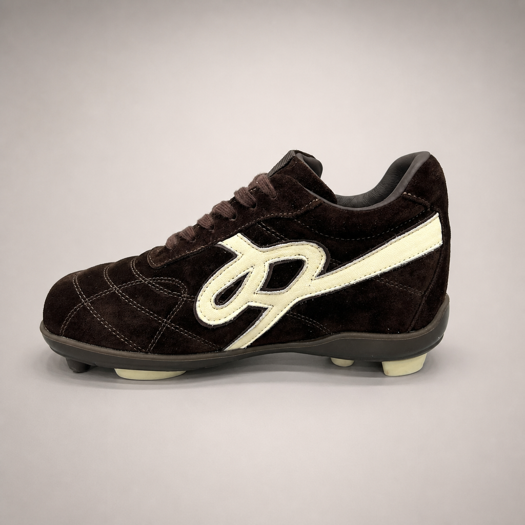 Dark Brown soccer shoe side profile showing a lace-up upper and molded outsole studs