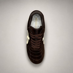 Dark Brown soccer shoe top view showing a lace-up upper and molded outsole studs