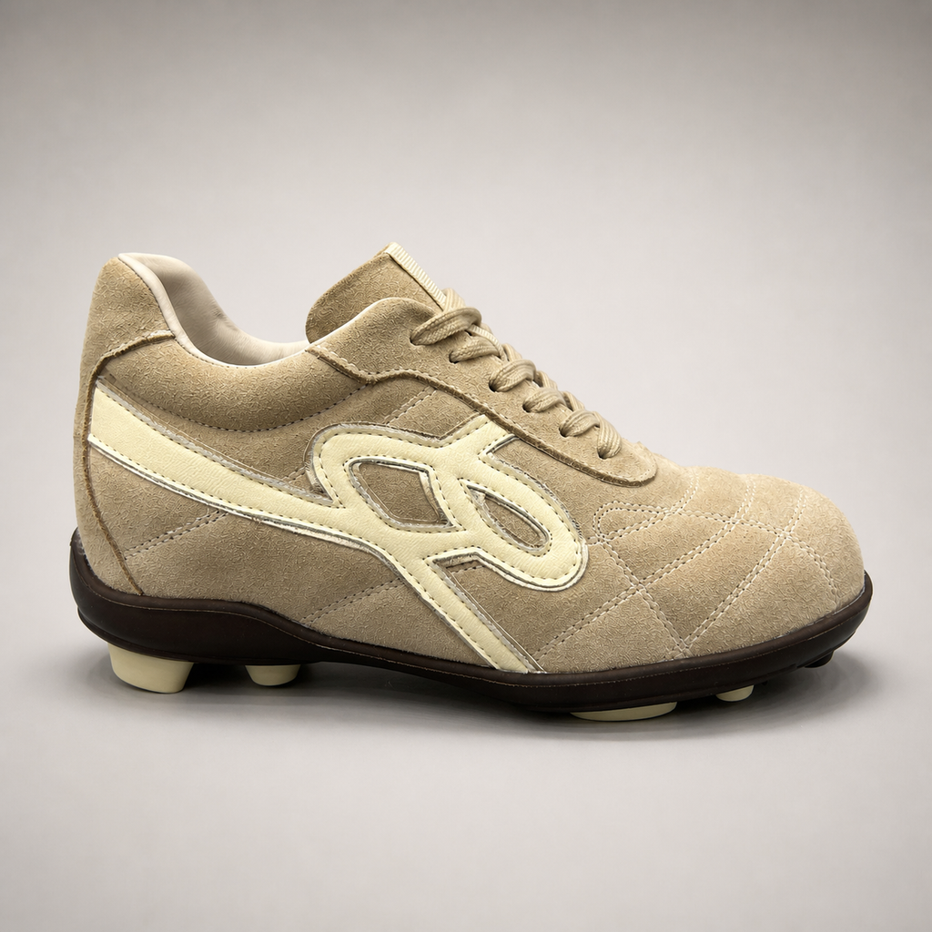 Beige soccer shoe second pair angle showing a lace-up upper and molded outsole studs
