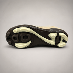 Beige soccer shoe outsole view showing the rubber outsole