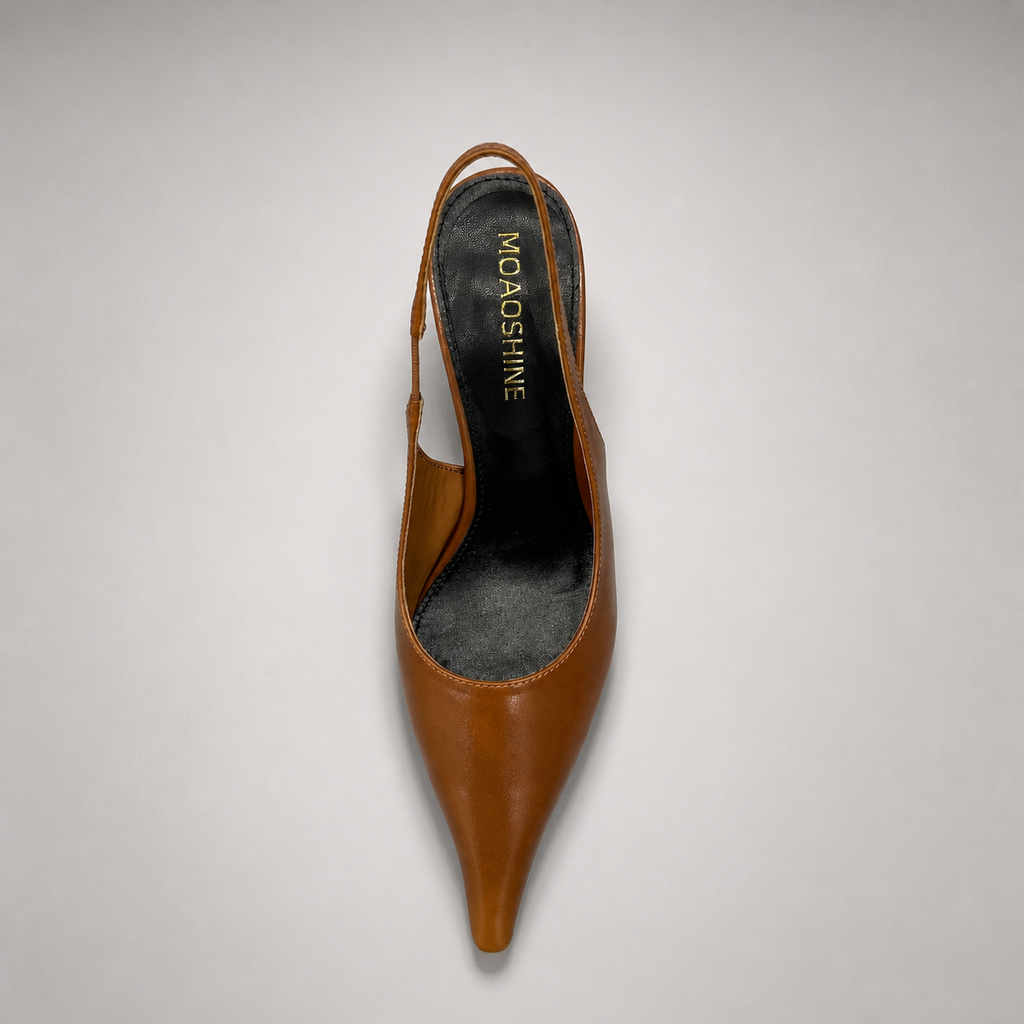 Brown wedge slingback pump rear view showing a pointed toe, slingback strap, and clear wedge heel
