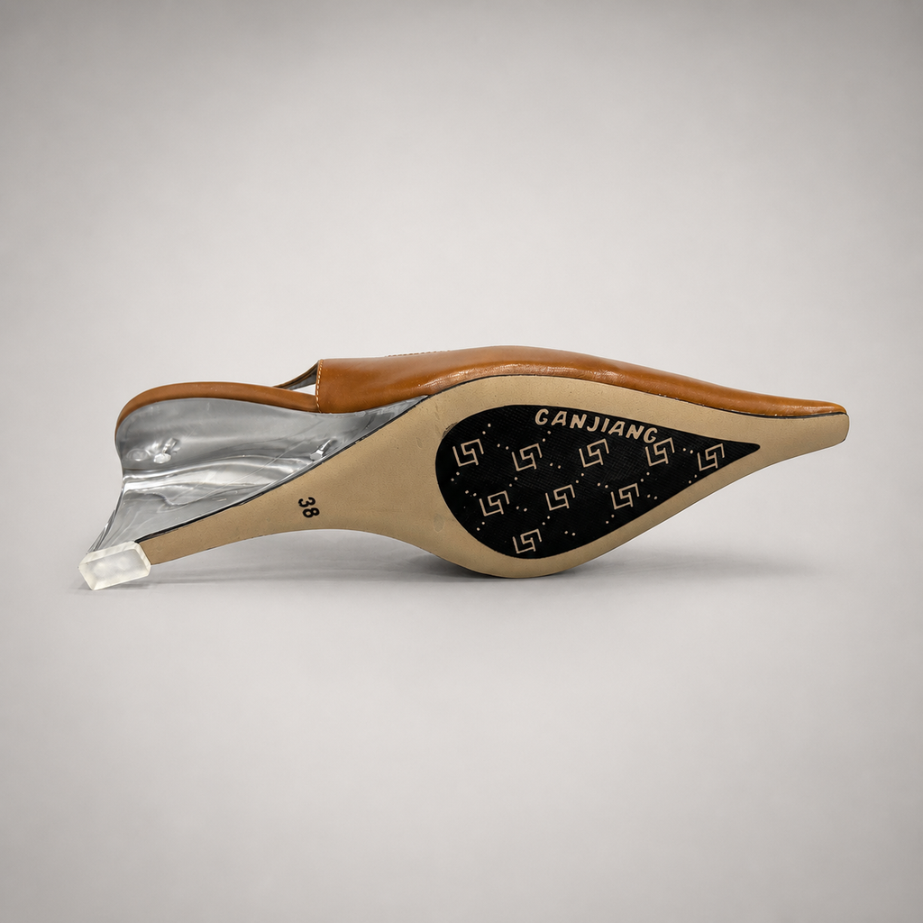 Brown wedge slingback pump top view showing a pointed toe, slingback strap, and clear wedge heel