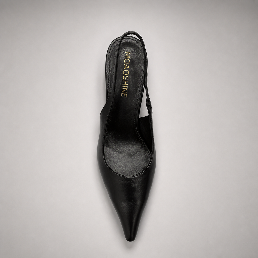 Black wedge slingback pump outsole view showing the cow leather outsole
