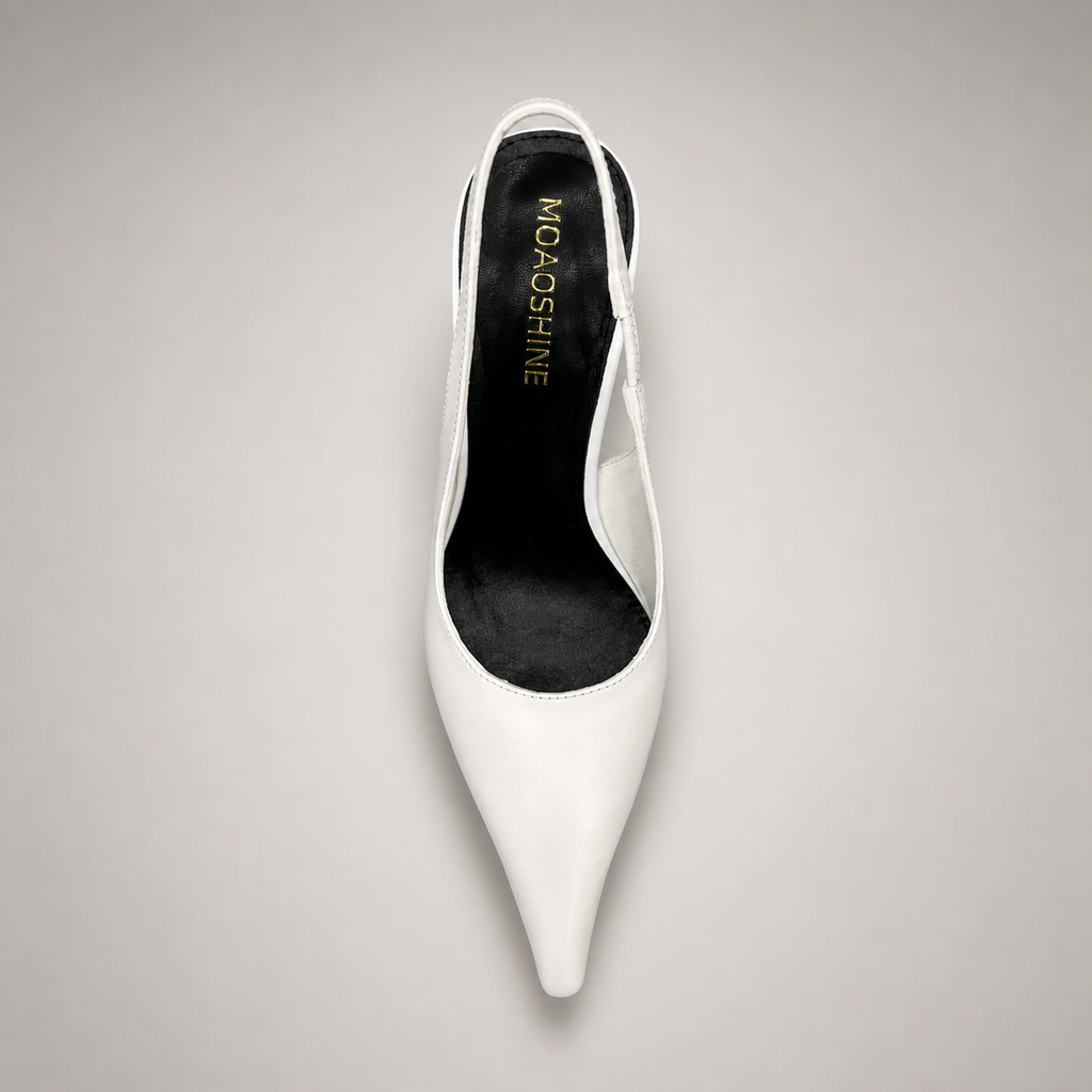 White wedge slingback pump outsole view showing the cow leather outsole