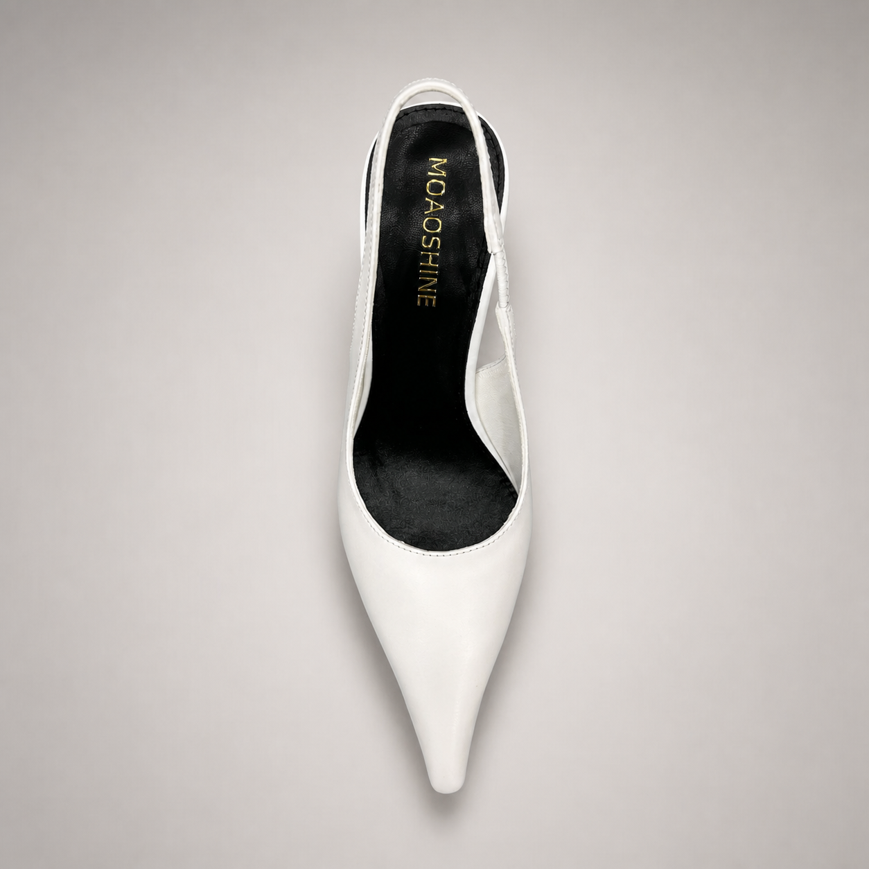 White wedge slingback pump outsole view showing the cow leather outsole