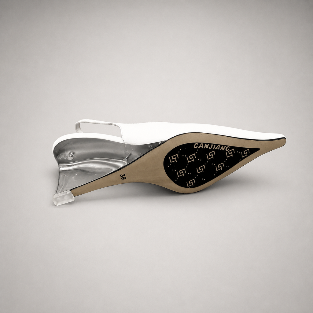 White wedge slingback pump top view showing a pointed toe, slingback strap, and clear wedge heel
