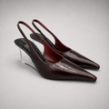 Burgundy wedge slingback pump pair three-quarter view showing a pointed toe, slingback strap, and clear wedge heel