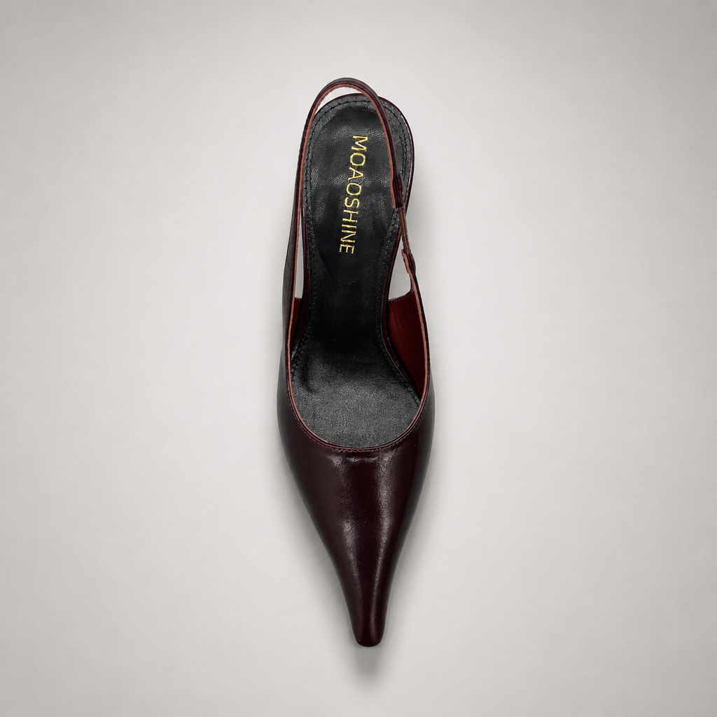 Burgundy wedge slingback pump top view showing a pointed toe, slingback strap, and clear wedge heel