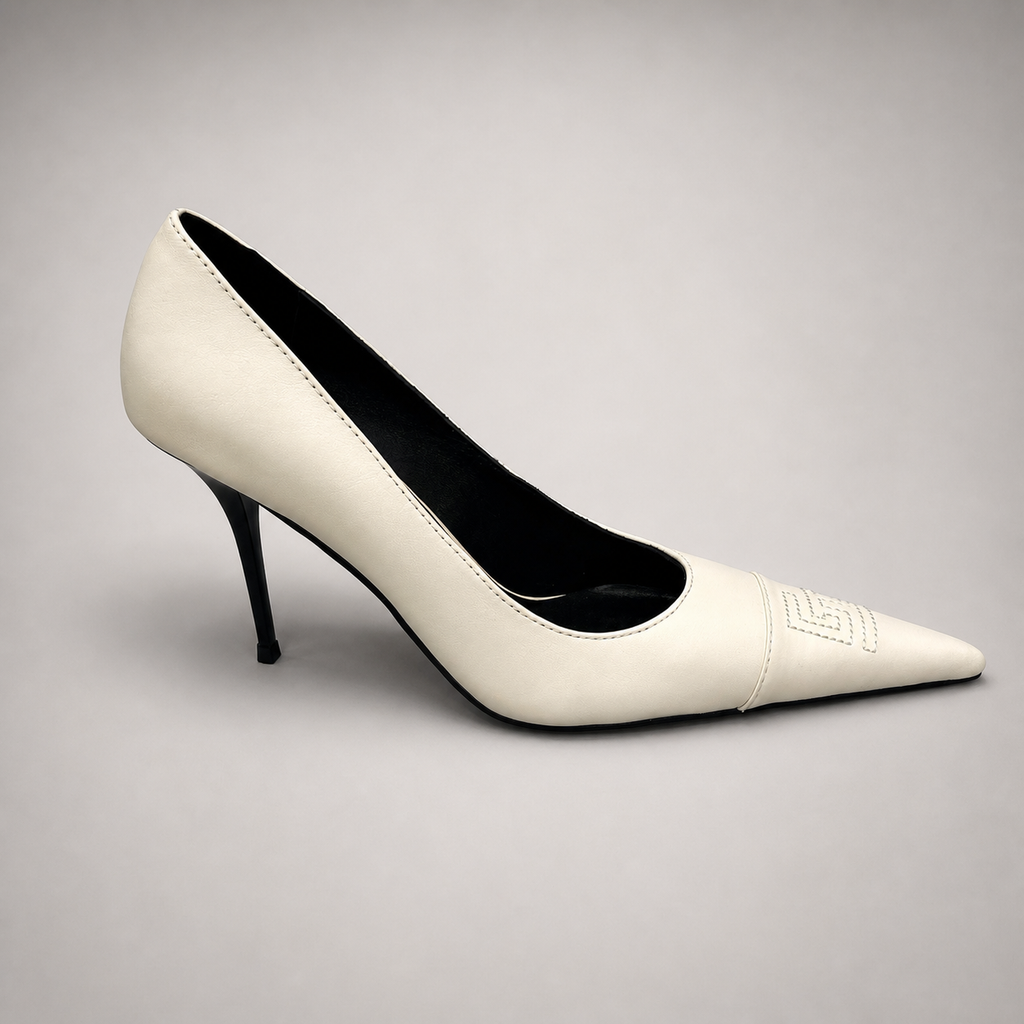 White pump side profile showing a pointed toe