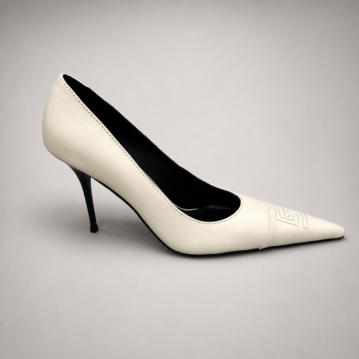 White pump side profile showing a pointed toe