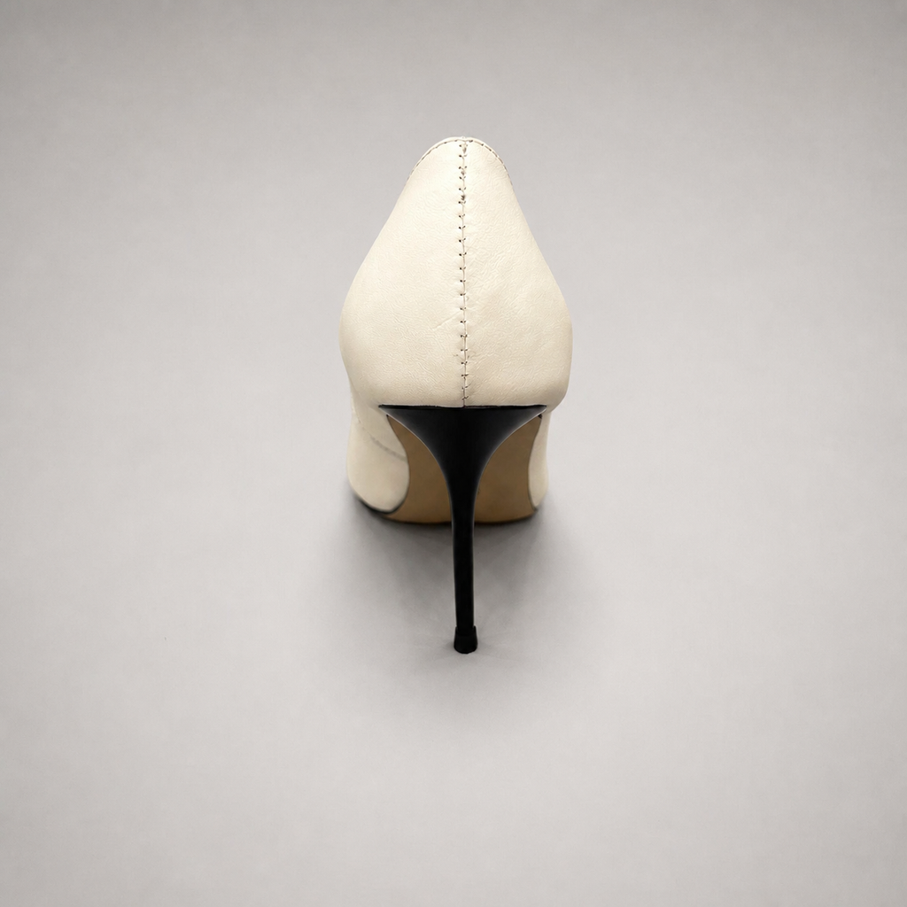 White pump rear view showing a pointed toe