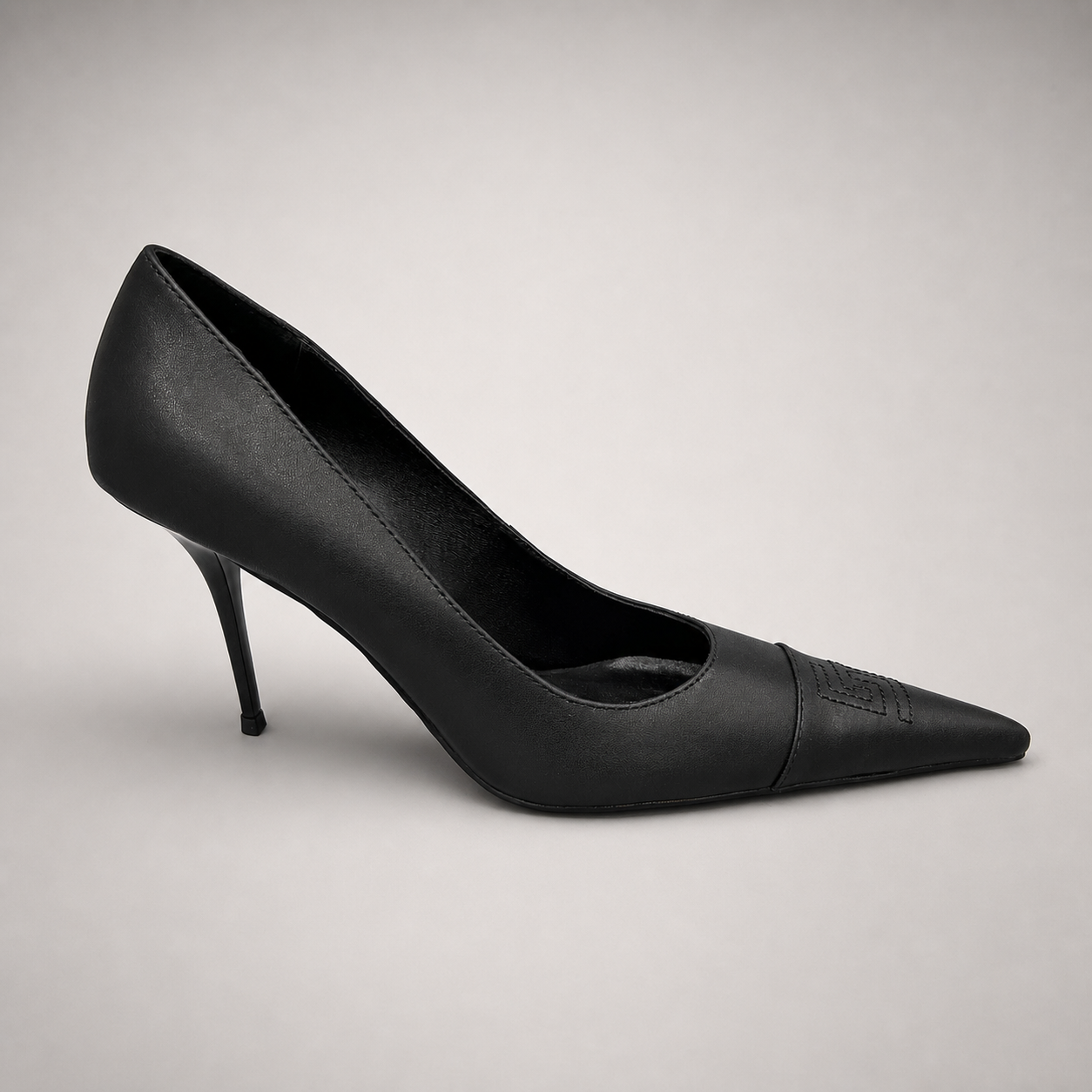 Black pump pair three-quarter view showing a pointed toe