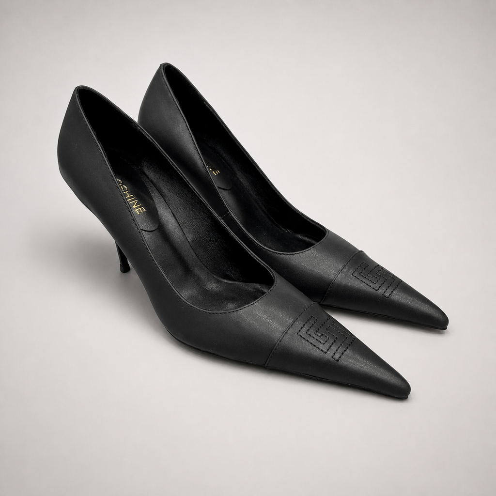 Black pump side profile showing a pointed toe