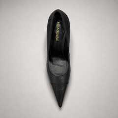 Black pump top view showing a pointed toe