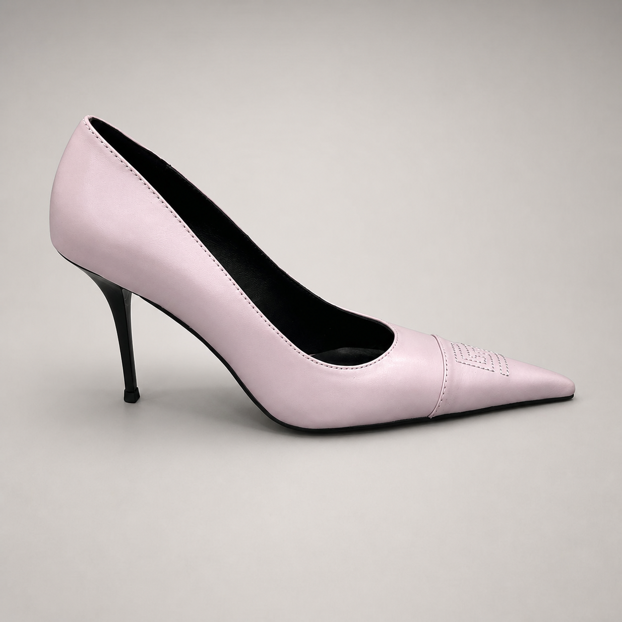 Pink pump side profile showing a pointed toe