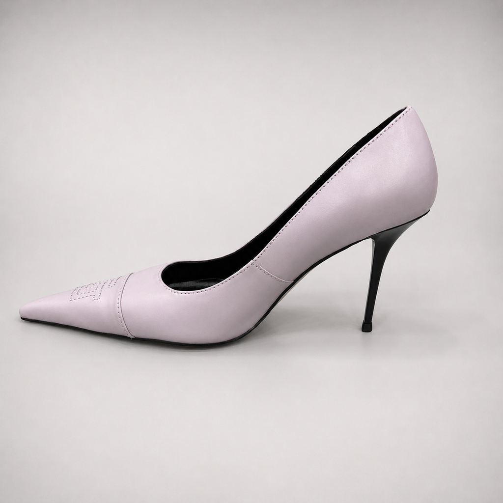 Pink pump opposite side profile showing a pointed toe