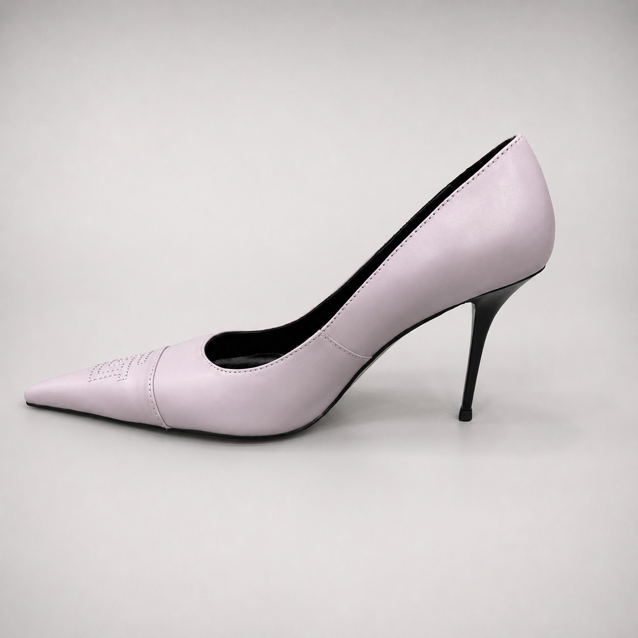 Pink pump opposite side profile showing a pointed toe