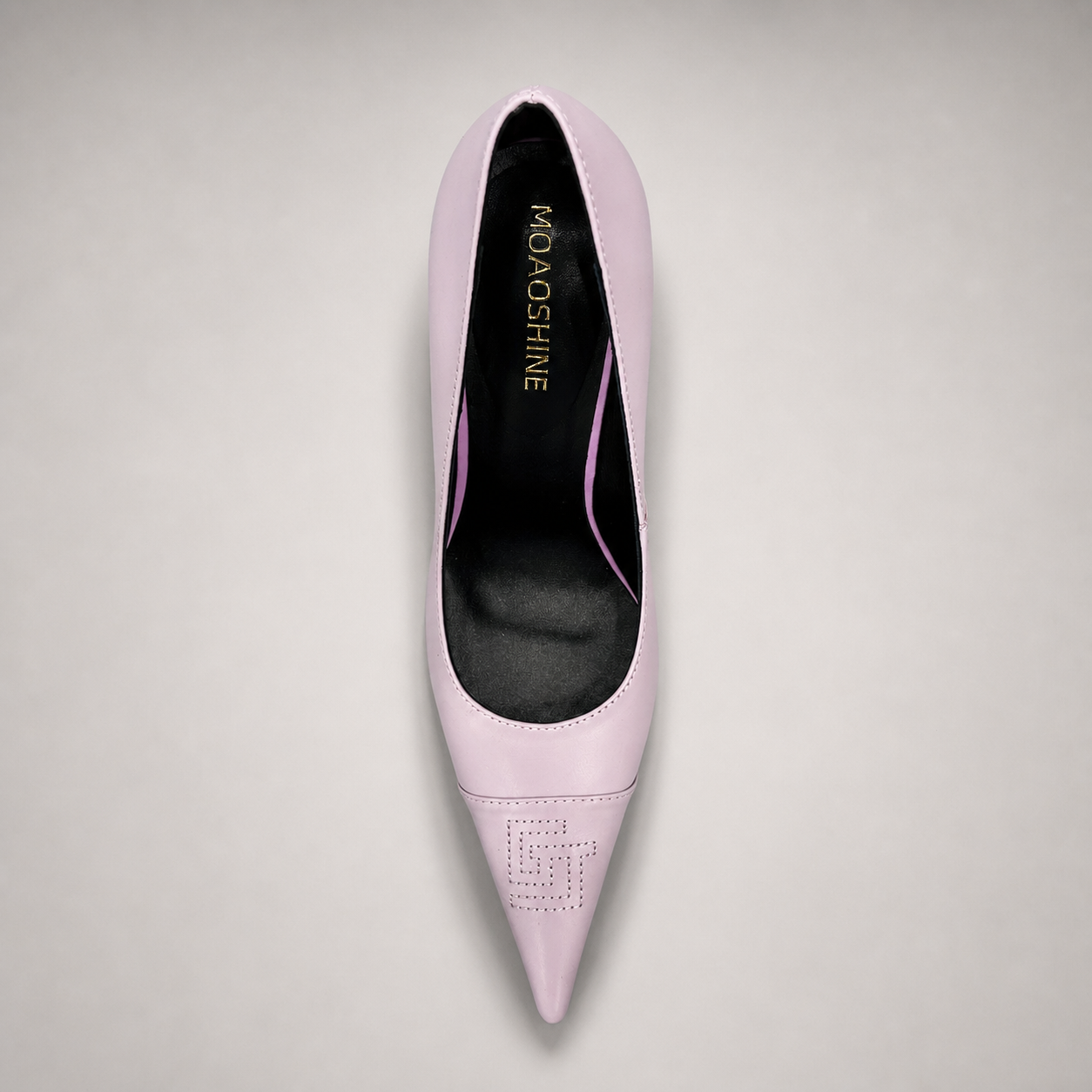 Pink pump top view showing a pointed toe