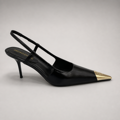 Black slingback pump side profile showing a pointed toe, slingback strap, and metal toe cap
