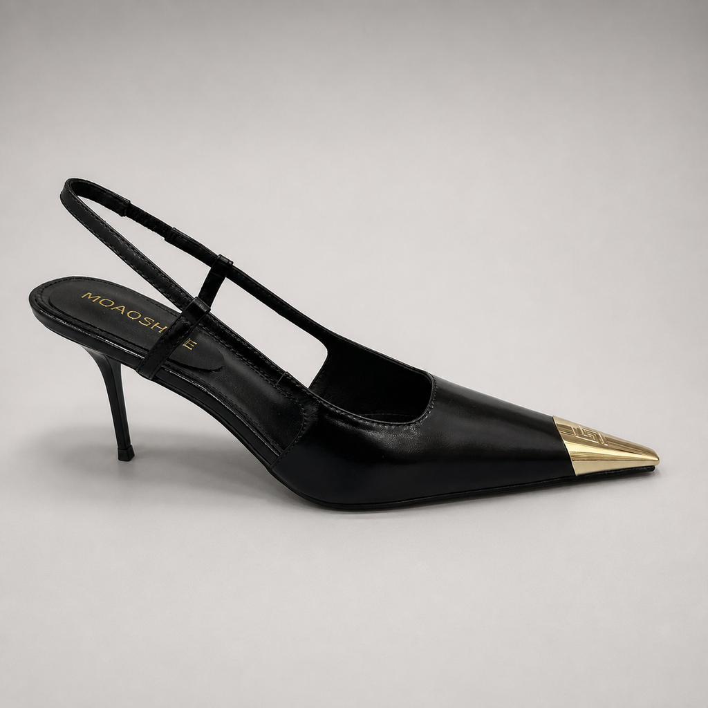 Black slingback pump side profile showing a pointed toe, slingback strap, and metal toe cap