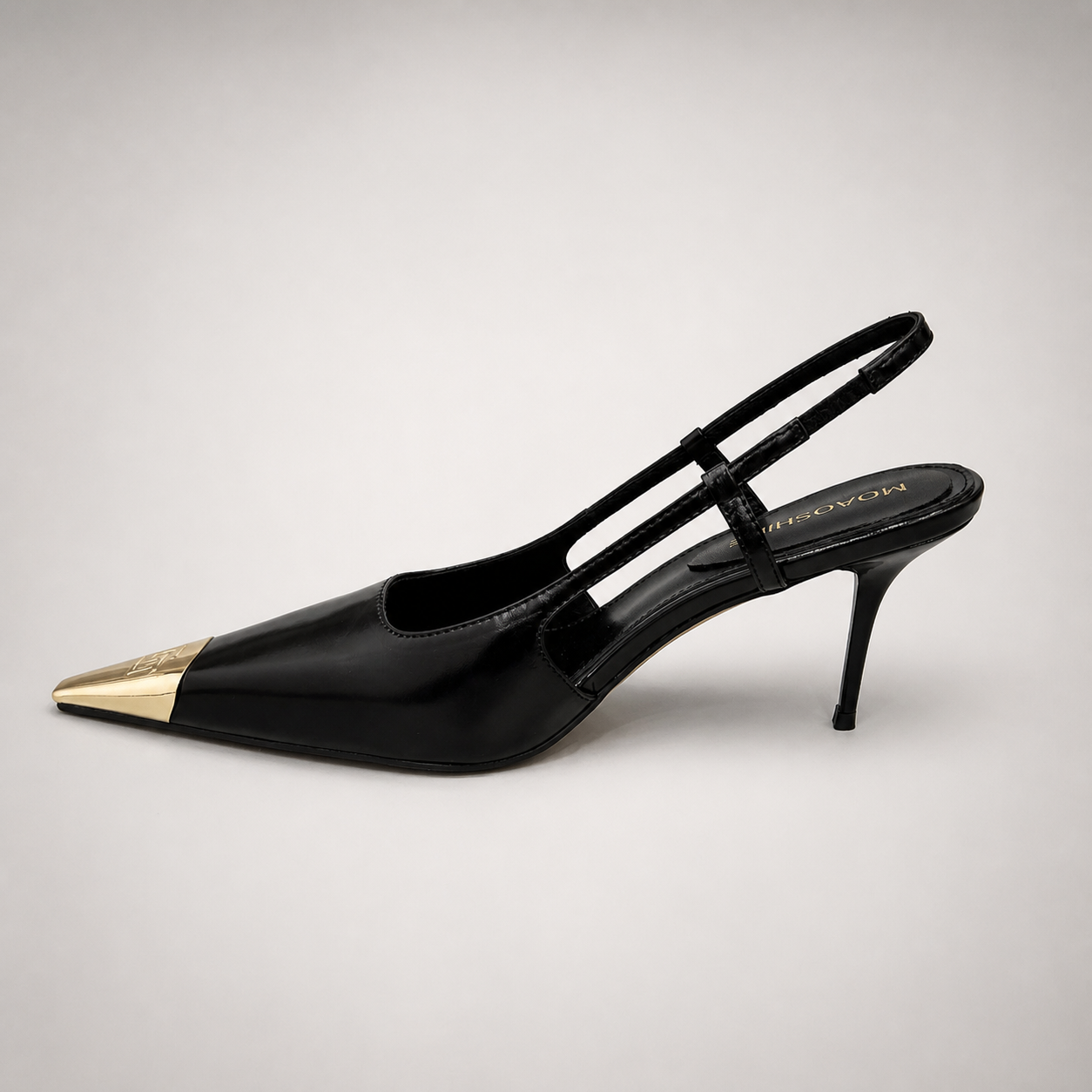 Black slingback pump opposite side profile showing a pointed toe, slingback strap, and metal toe cap