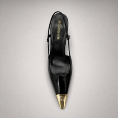 Black slingback pump outsole view showing the cow leather outsole