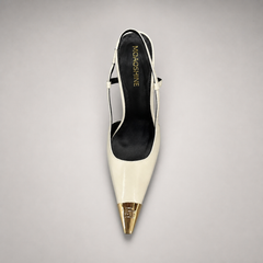White slingback pump top view showing a pointed toe, slingback strap, and metal toe cap